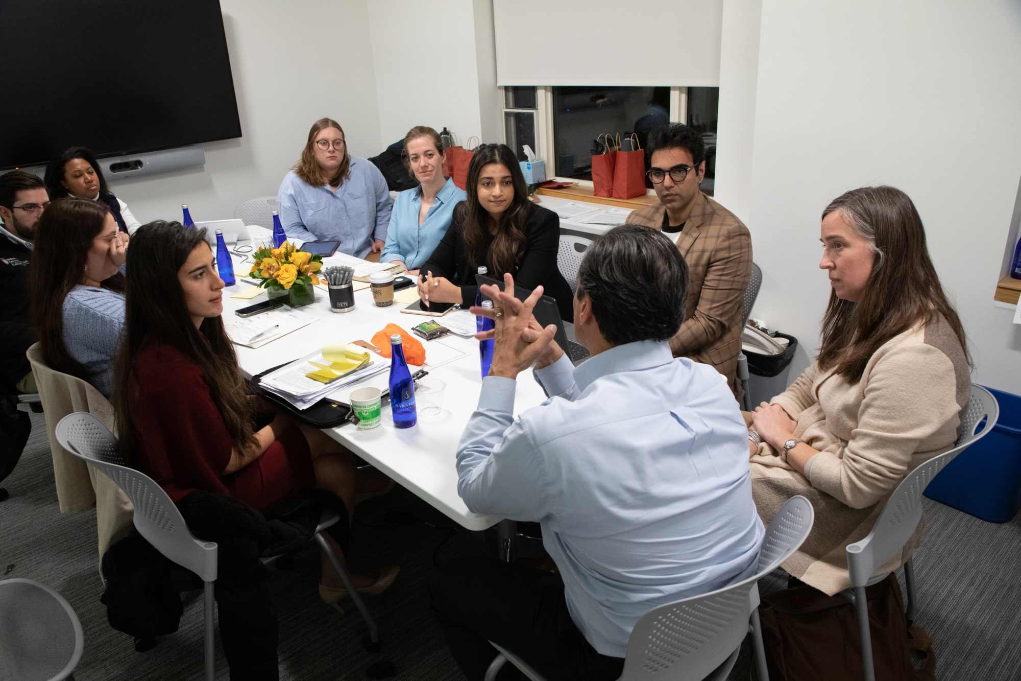 Harvard Fellows at a table in discussion